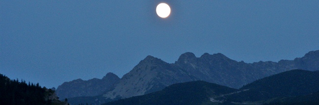 the moon over the mountains